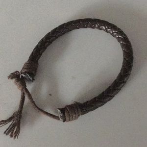 A dark brown leather bracelet